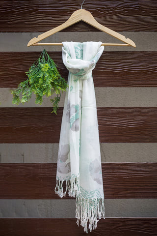 Luxuriously soft stole in white with large grey and green flowers