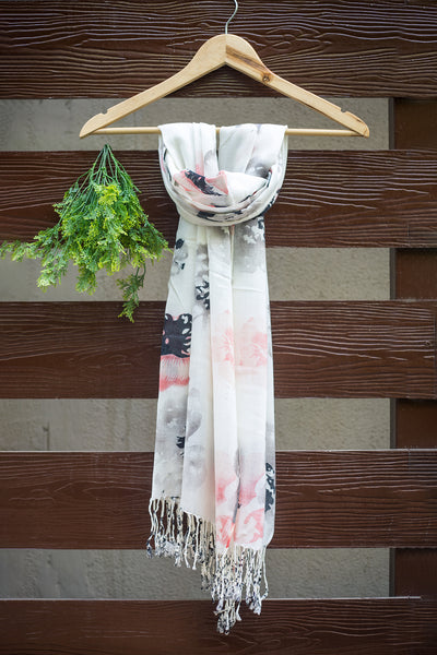 Luxuriously soft stole in white with grey, black and peach flowers